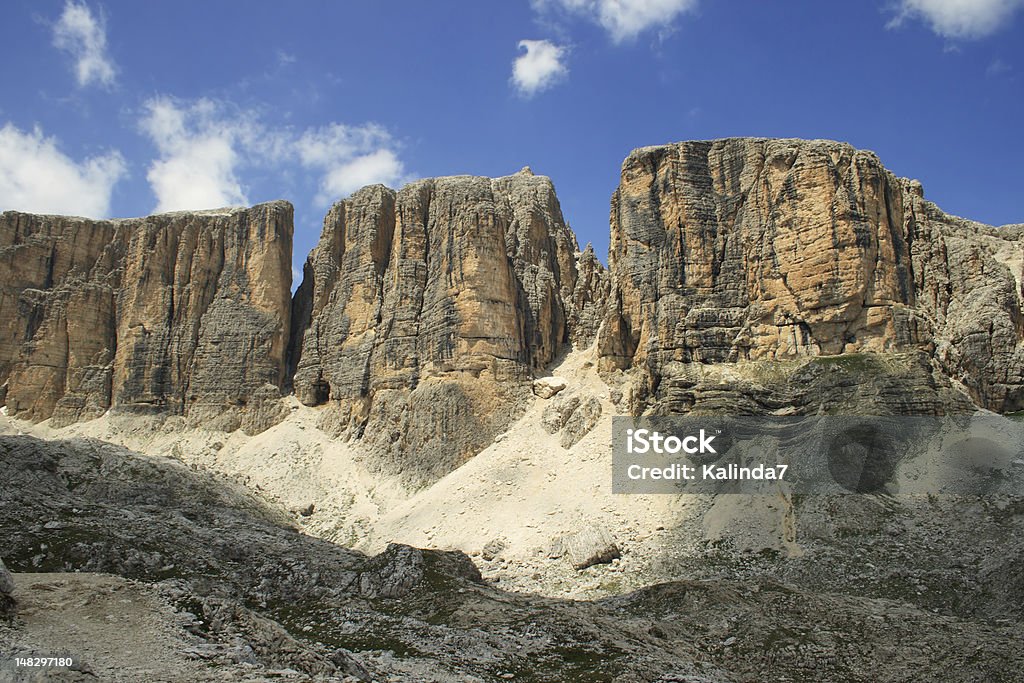 Majestic cliffs Towering Dolomite cliffs of the Sella Group, South Tyrol, North Italy. Abstract Stock Photo