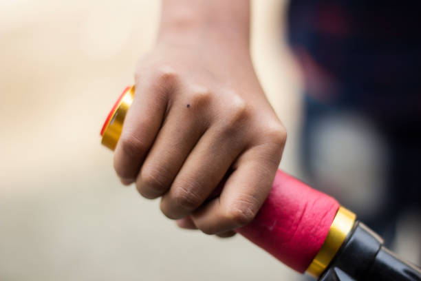 istock A hand holding the handle of a bicycle and blurred behind 1482972068