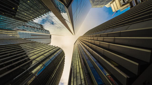 4K Footage Time lapse of Low angle view of business corporate building skyscraper in downtown district of London, United Kingdom