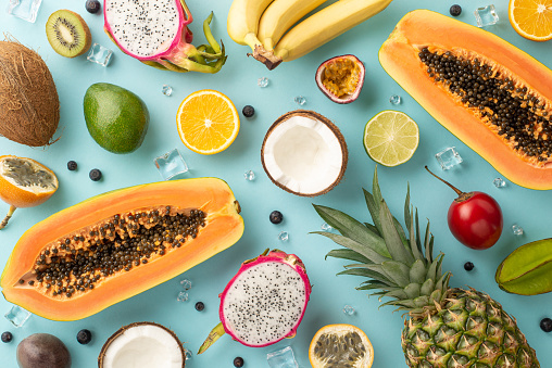 Colorful raw fruits and vegetables varied vegan food, vivid rainbow arrangement full frame background