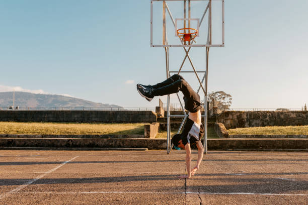 istock teenage boy breakdancing 1482983835