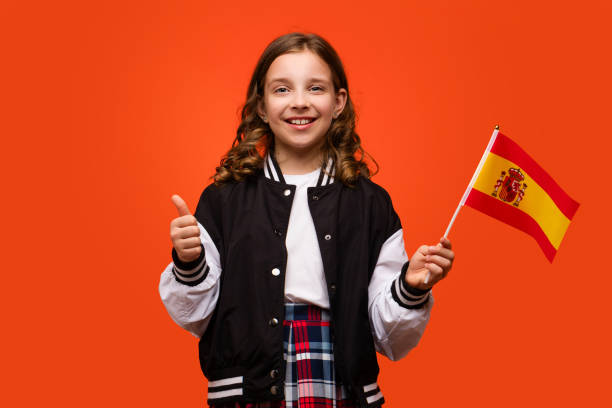 istock Girl holds small flag Spain 1482986062