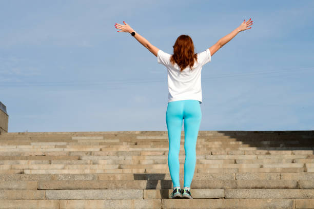 istock Woman doing warm up before workout on street 1482986078