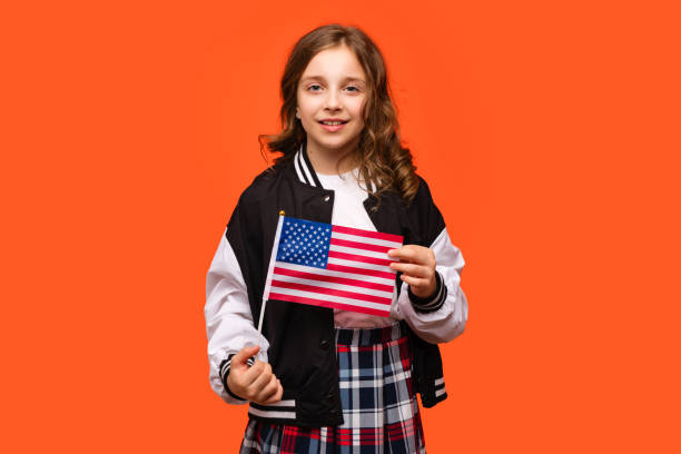 istock Girl holding small USA flag 1482986141