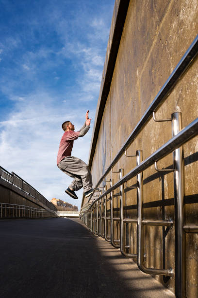 istock Man doing parkour. Extreme sports 1482986252