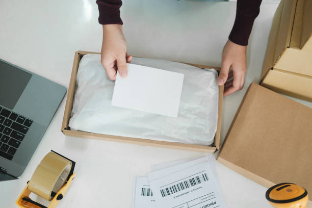 istock Female online business owner packing package. 1482988414