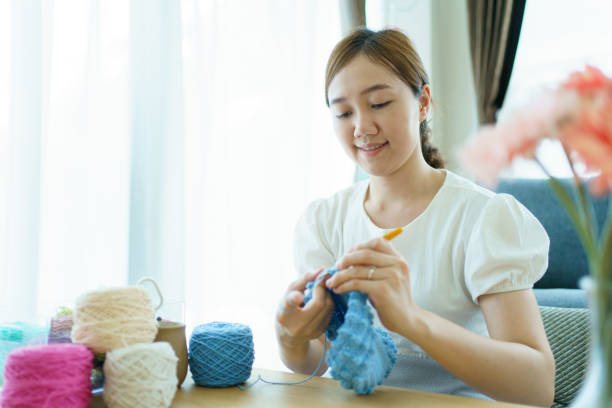 istock Woman making a crochet craft. 1482988497
