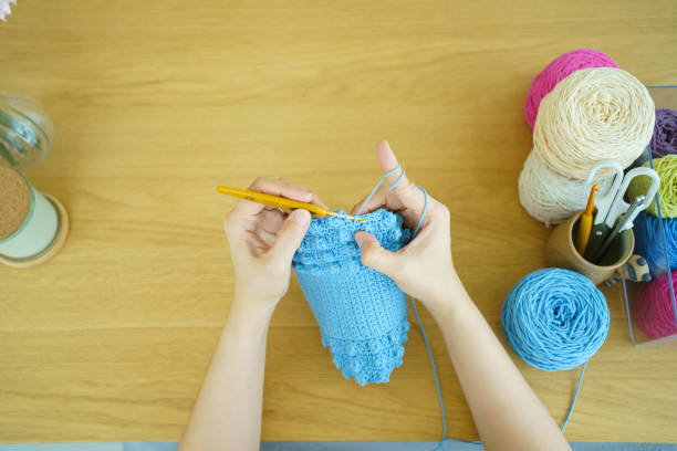 istock Woman making a crochet craft. 1482988586