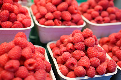 strawberry raspberries and blackberries on the market in containers
