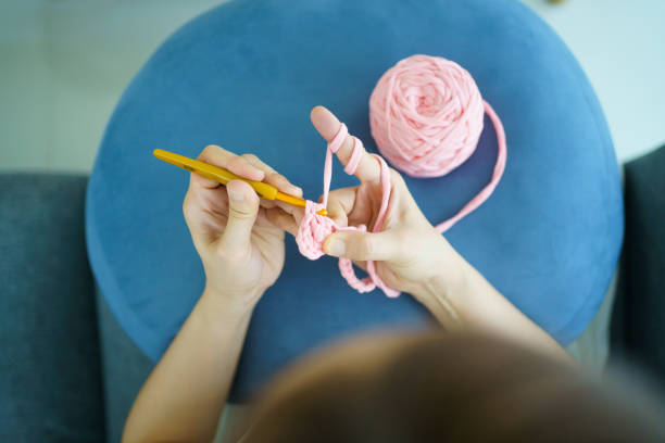 istock Woman making a crochet craft. 1482988699