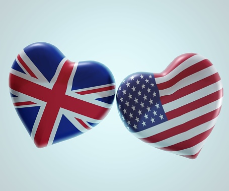 The national flag of the United States of America in heart shape with united kingdom flag in heart shape side by side d rendering