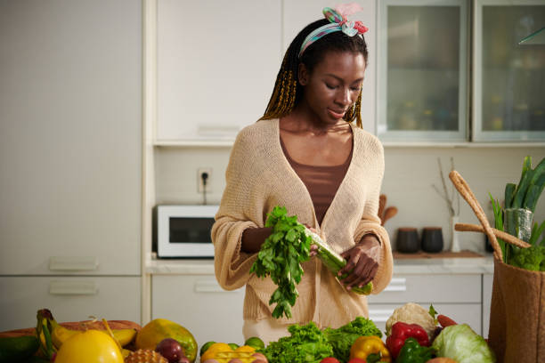 istock Woman Looking at Fresh Groceries 1482990587