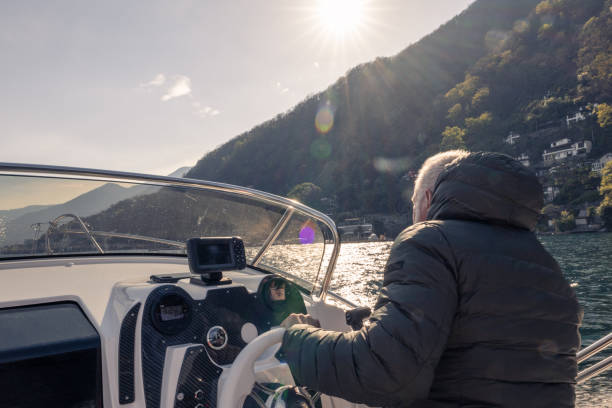 istock Mature man piloting boat 1482992404