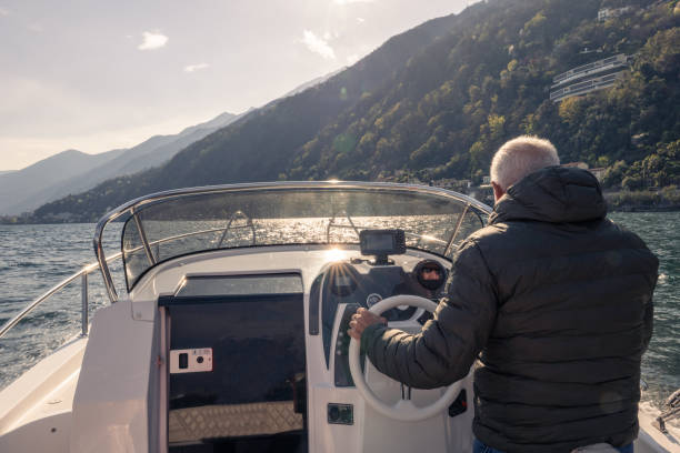 istock Mature man piloting boat 1482992627