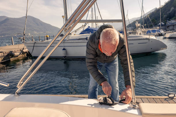 istock Mature man tying knots to his boat 1482992679