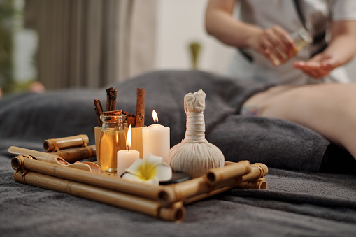 Tray with candles and oils for massage spa procedures