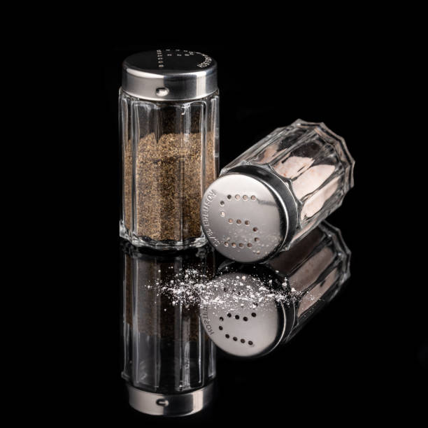 istock Salt and pepper shaker isolated on black background 1482994318