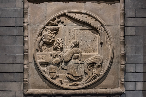 A relief of children and old people