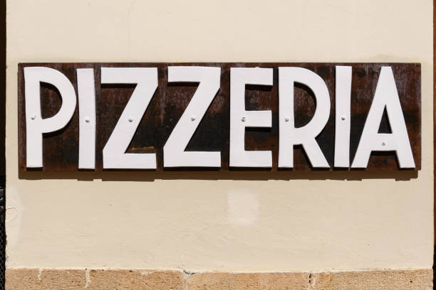 Burano, Italy - June 25, 2025: Cicchetti sign showcases mix of five dishes priced at 14.50 in lively outdoor restaurant atmosphere
