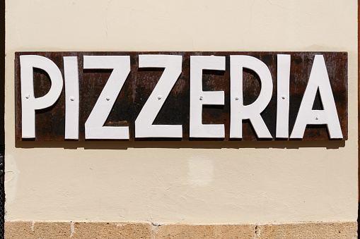 Italian pizzeria sign in Tuscany