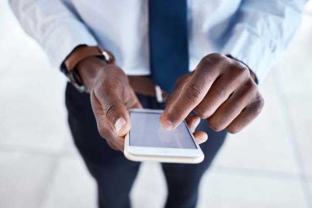 istock Black man hands , phone screen zoom and mobile communication with 5g connection. Writing, social media scroll and email typing business employee outdoor networking online on technology and internet 1482999187