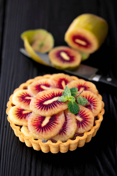 Sweet raw vegan cake in plate with jelly on top