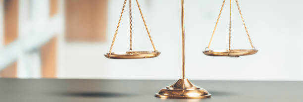 istock Shiny golden scale balance in library background as justice symbol. equility 1483002113