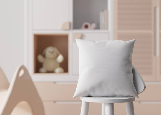 istock White square pillow in kids room. Blank cushion case template for your graphic design presentation. Pillow cover mock up for print, pattern, personalized illustration. Close-up. 3D rendering. 1483002244
