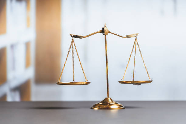 istock Shiny golden scale balance in library background as justice symbol. equility 1483002898