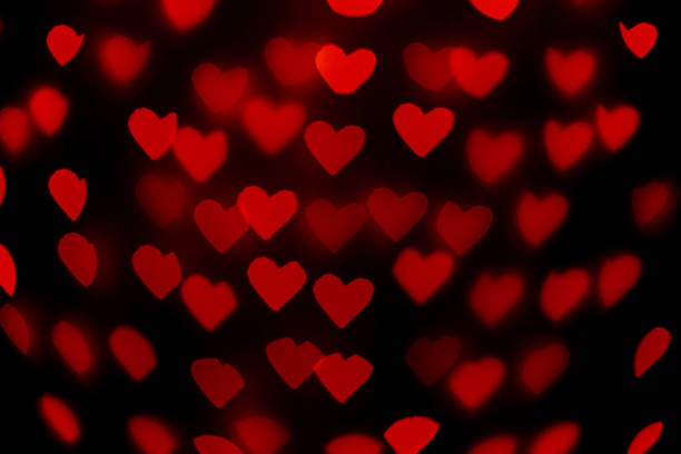 istock beautiful hearts made of lights on a blurred background 1483005833