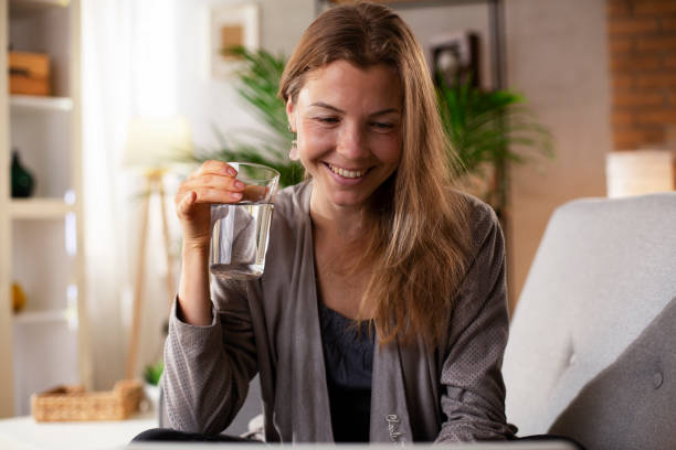 istock Woman using laptop at home 1483005937