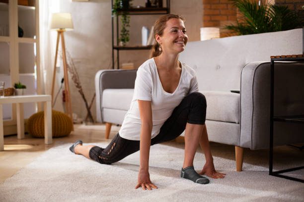 istock Young woman working out at home. 1483006148