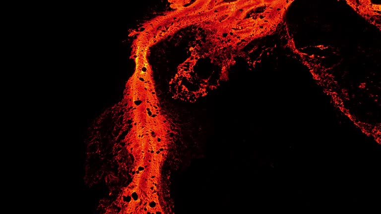 Aerial video of lava erupting and flowing from a mountain, Iceland