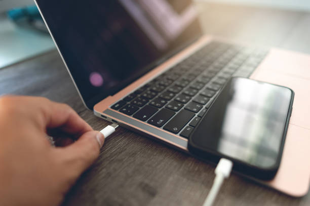 istock Connect your smartphone to your laptop computer 1483007116