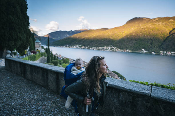 istock Mother and infant explore lakeshore together 1483008162