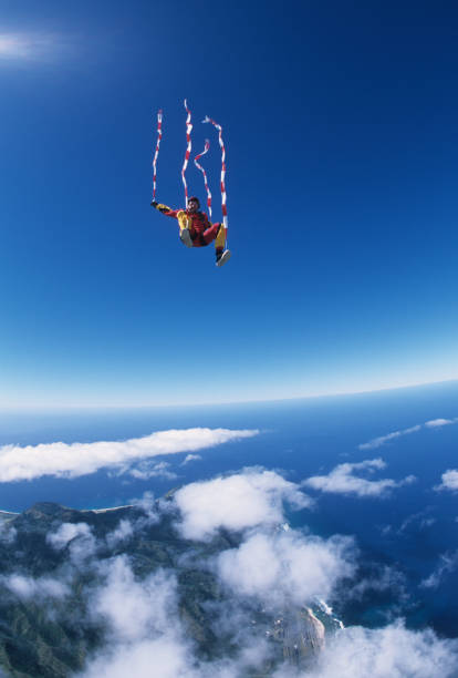 istock Skydiver in free fall with colourful streamer 1483010174