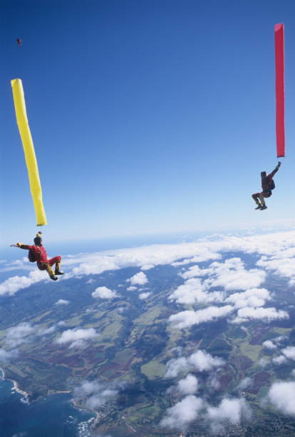 istock Skydivers in free fall with colourful streamers 1483010179