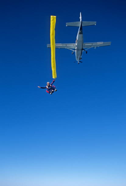 istock Skydivers in free fall with colourful streamers 1483010210