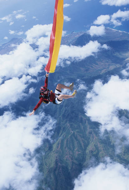 istock Skydiver in free fall with colourful streamer 1483010297