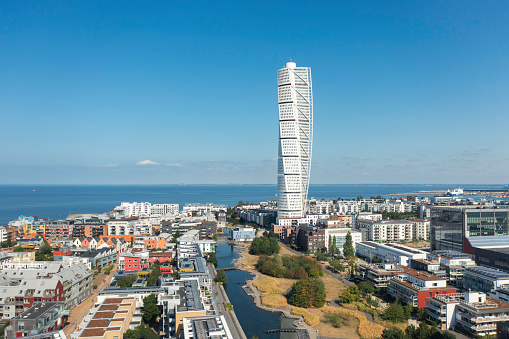 Aerial view of the Västra Hamnen (West Harbor) district in Malmö, with the Turning Torso building rising high above the surrounding apartment buildings.