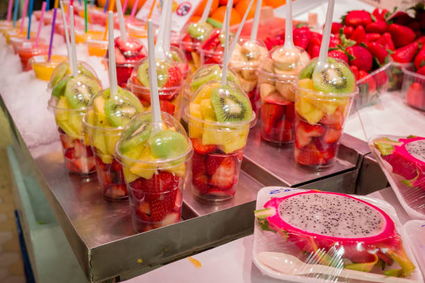 istock Fresh fruit juice Kiwi, Melons, Mango, Passion,  on ice at the market 1483010918