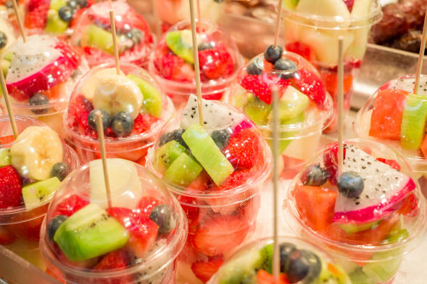 istock Fresh fruit juice Kiwi, Melons, Mango, Passion,  on ice at the market 1483010950