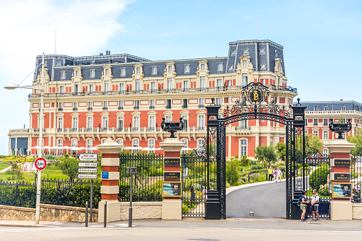 Entrance gate of Hotel du Palais in Biarritz, France on a summer dady
