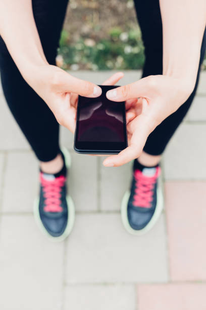 istock Closeup of woman using mobile phone 1483013696