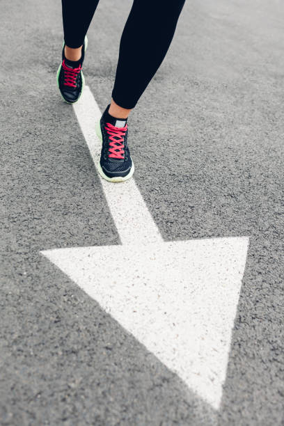 istock Woman running on road 1483013745