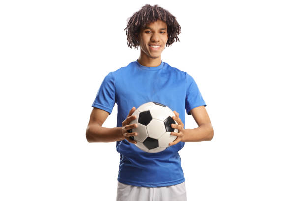 African american soccer player holding a ball