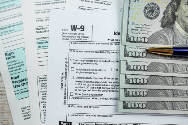 istock 2022 blank individual income taform with dollar on desk 1483014370