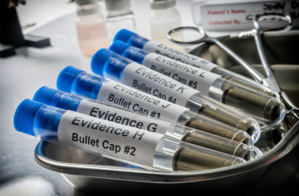 istock Crime lab, several bullet casings in marked vials, to analyse suspects, concept imag 1483016766