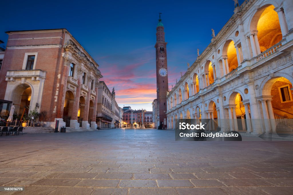 Vicenza, Italy. Cityscape image of historical centre of Vicenza, Italy with old square ( Piazza dei Signori) at sunrise. Town Square Stock Photo