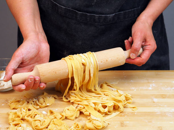 istock The chef prepares noodles at home in the kitchen 1483017026
